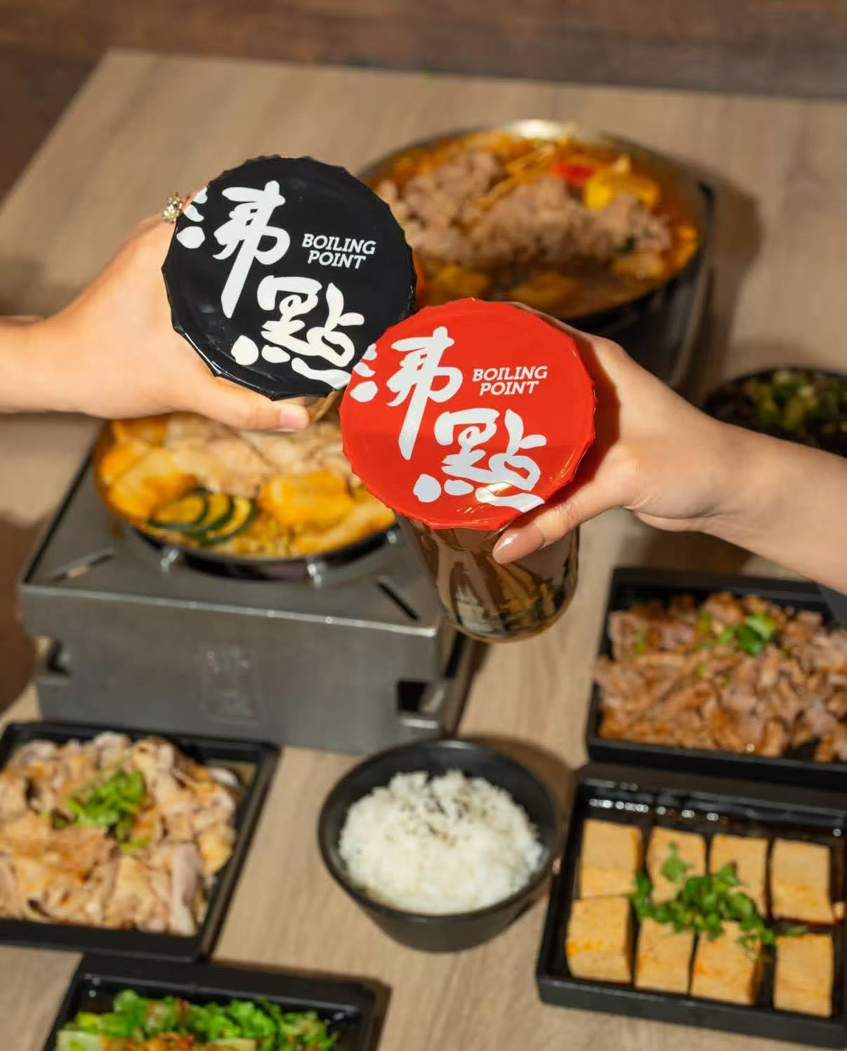 Boiling Point branded drinks and hot pot meal spread
